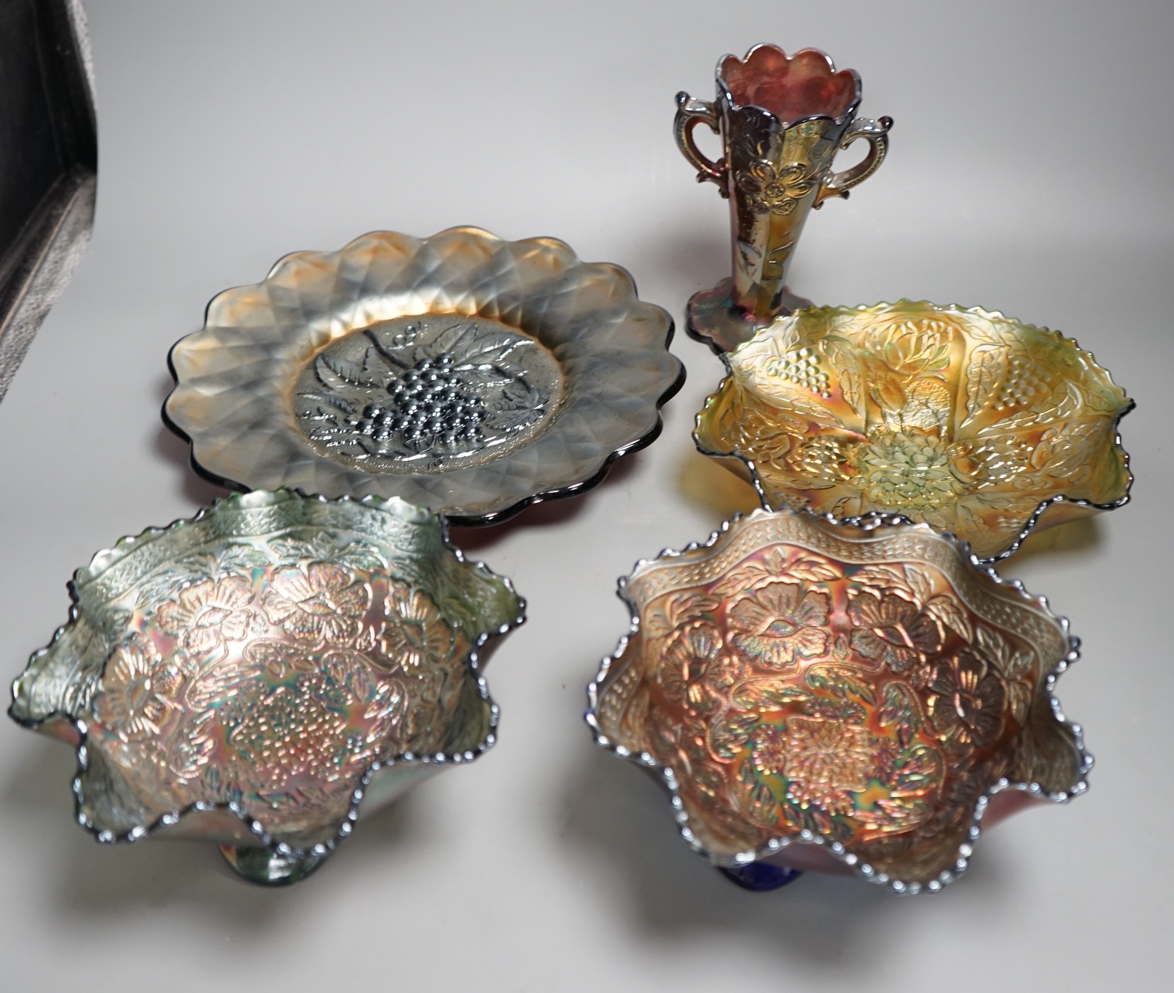 A group of four American Carnival glass dishes and a two handled vase (5), largest dish 28cms diameter